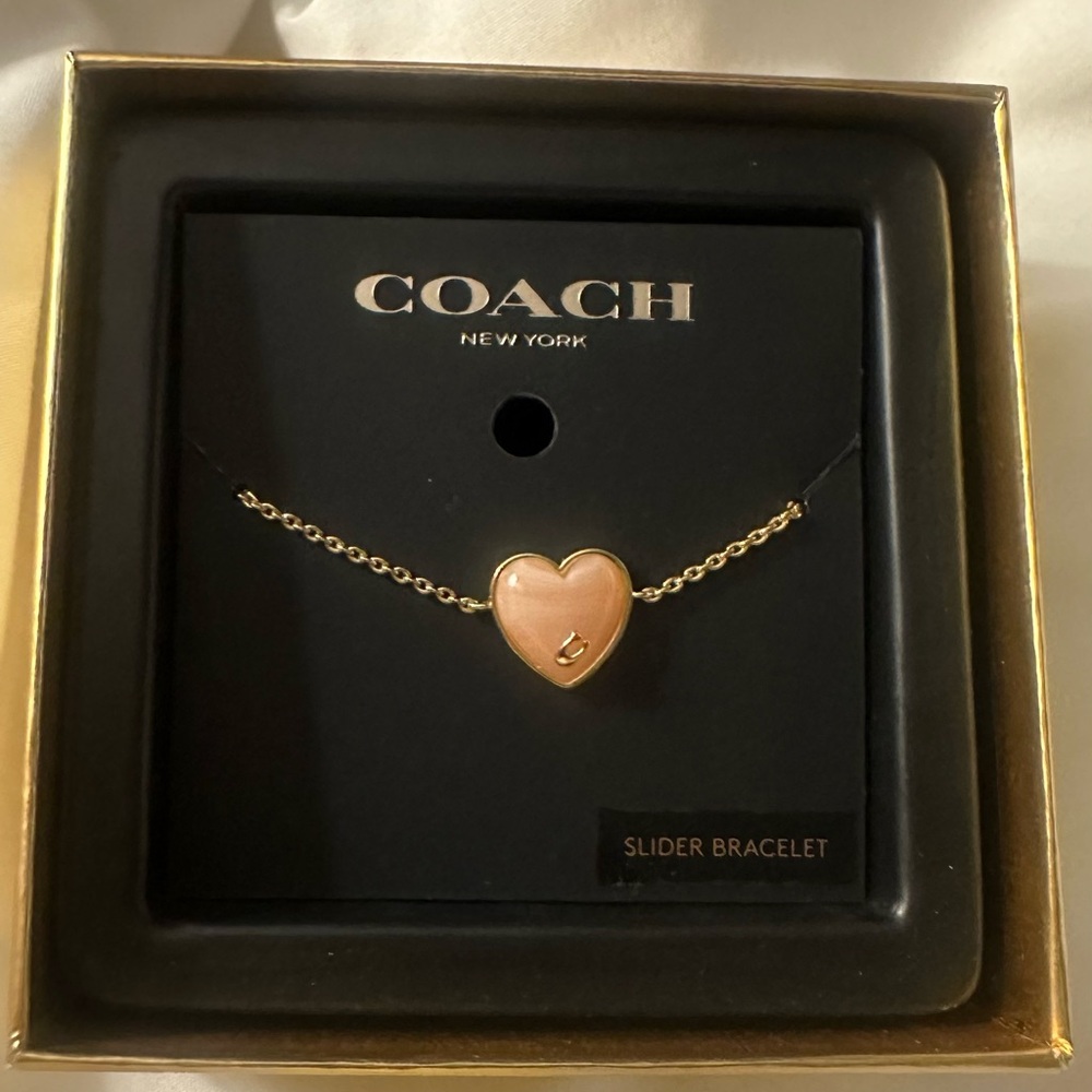 Coach Gold-Tone Bracelet with Pink Heart Charm